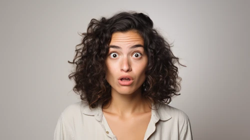 Woman with curly hair and a surprised expression by Midjourney