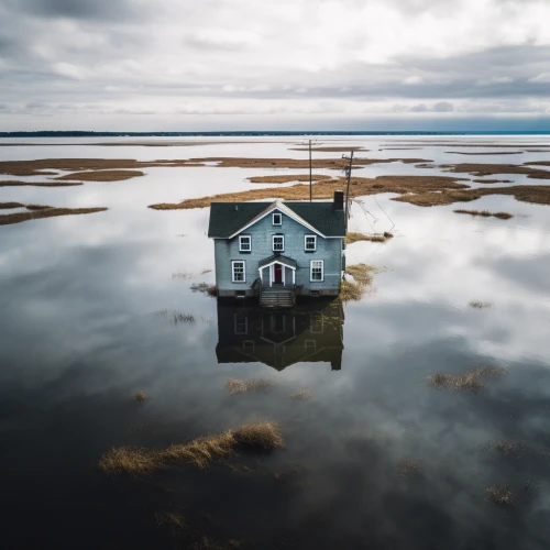 Lone house in a flooded area by Midjourney