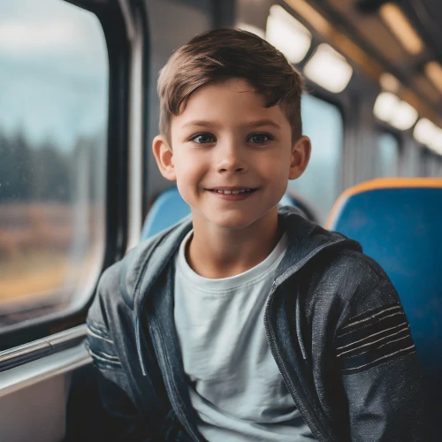 Boy sitting in a train by Adobe Firefly