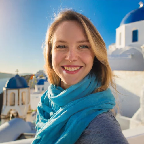 Woman taking a selfie near blue domes by Adobe Firefly